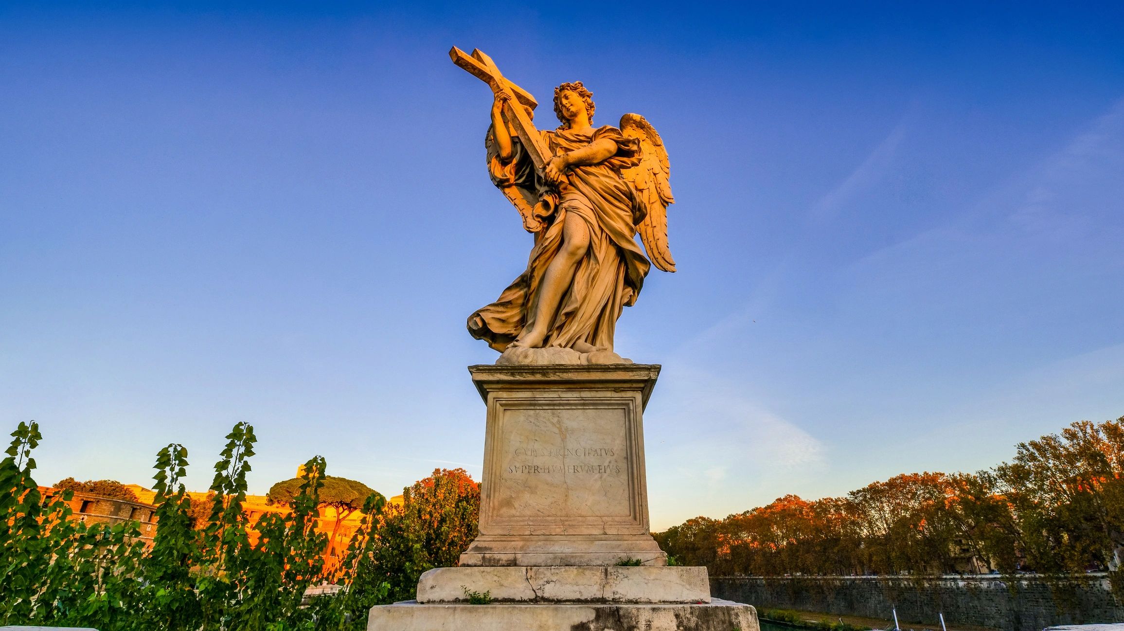 Warm sunset light on a classical angel statue