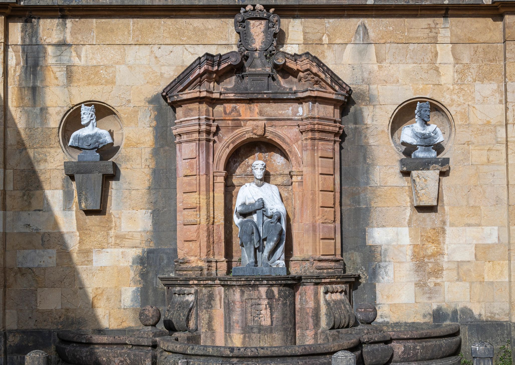 Historic fountain sculpture in a formal garden